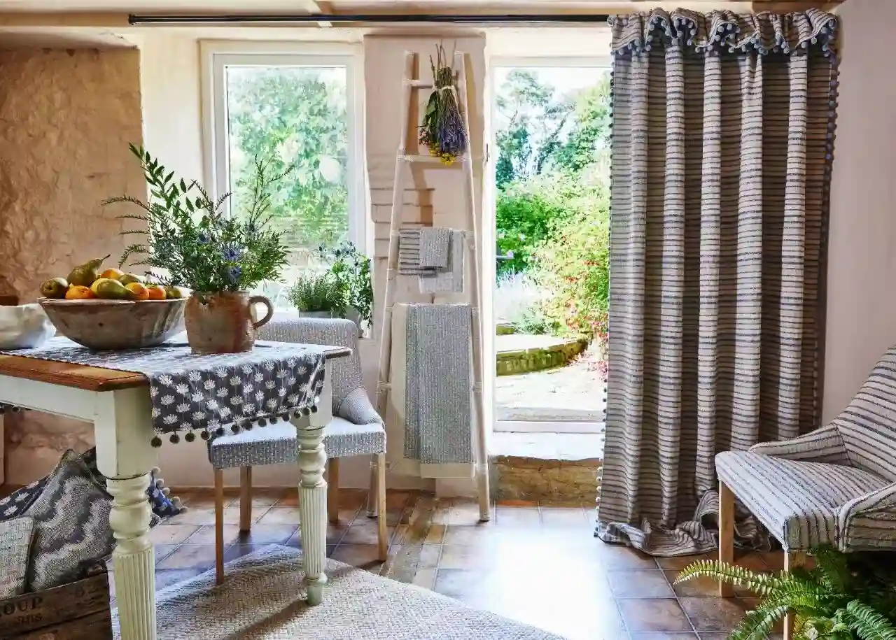 Patterned full-length curtains framing a character-home window