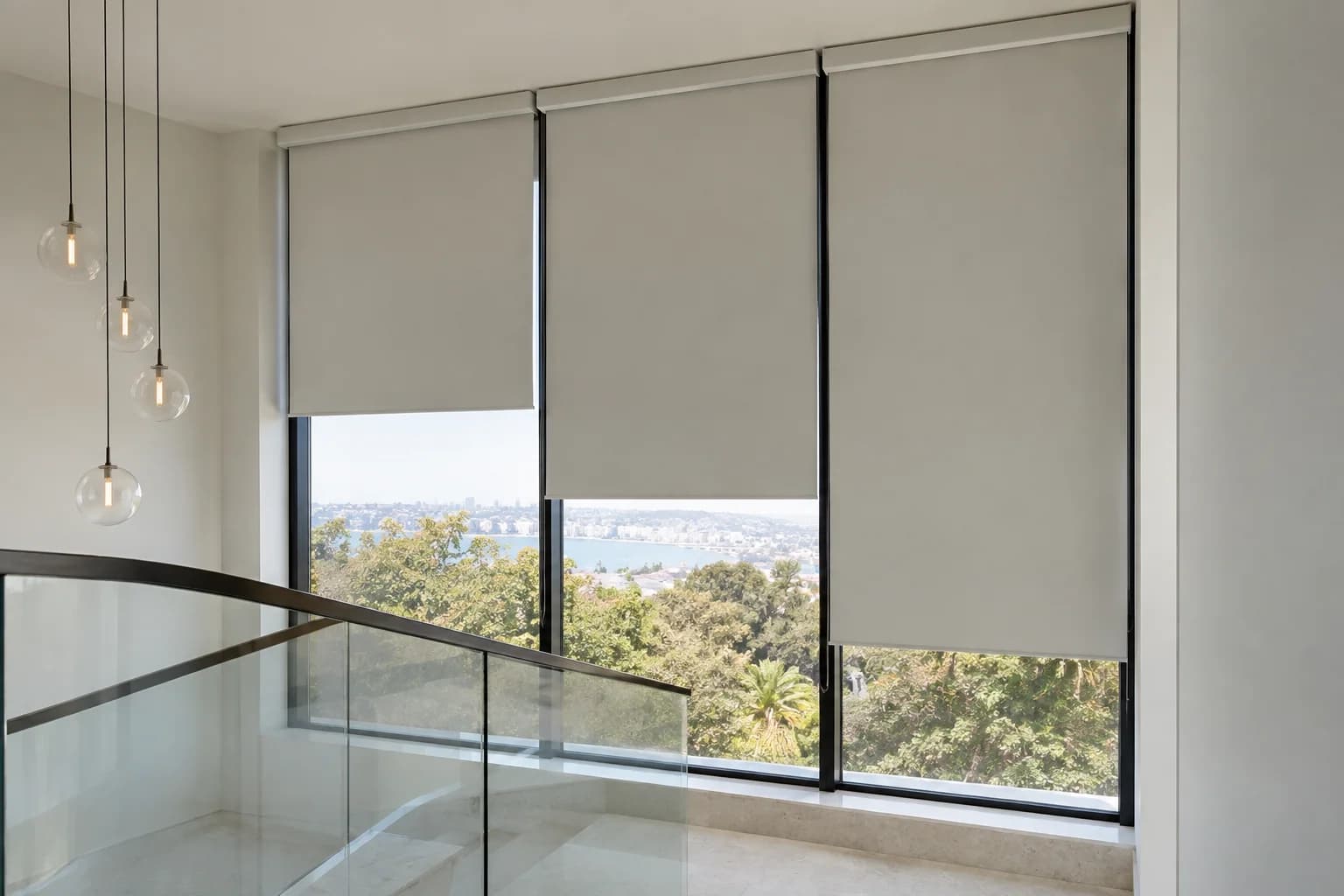 Motorised roller blinds divided across high glazing