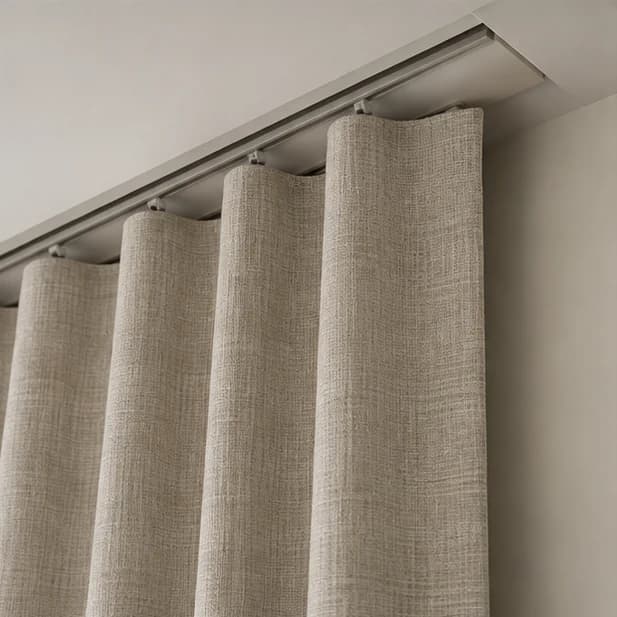 Illustrated recessed curtain track with carriers and fabric heading; motor is not shown