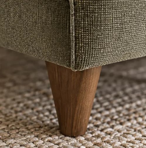 Close view of upholstery, seam and timber furniture leg