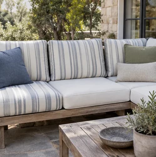 Outdoor sofa with replacement cushion covers refitted to the frame