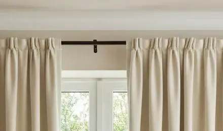 Real pleated curtain headings fitted neatly to a visible pole