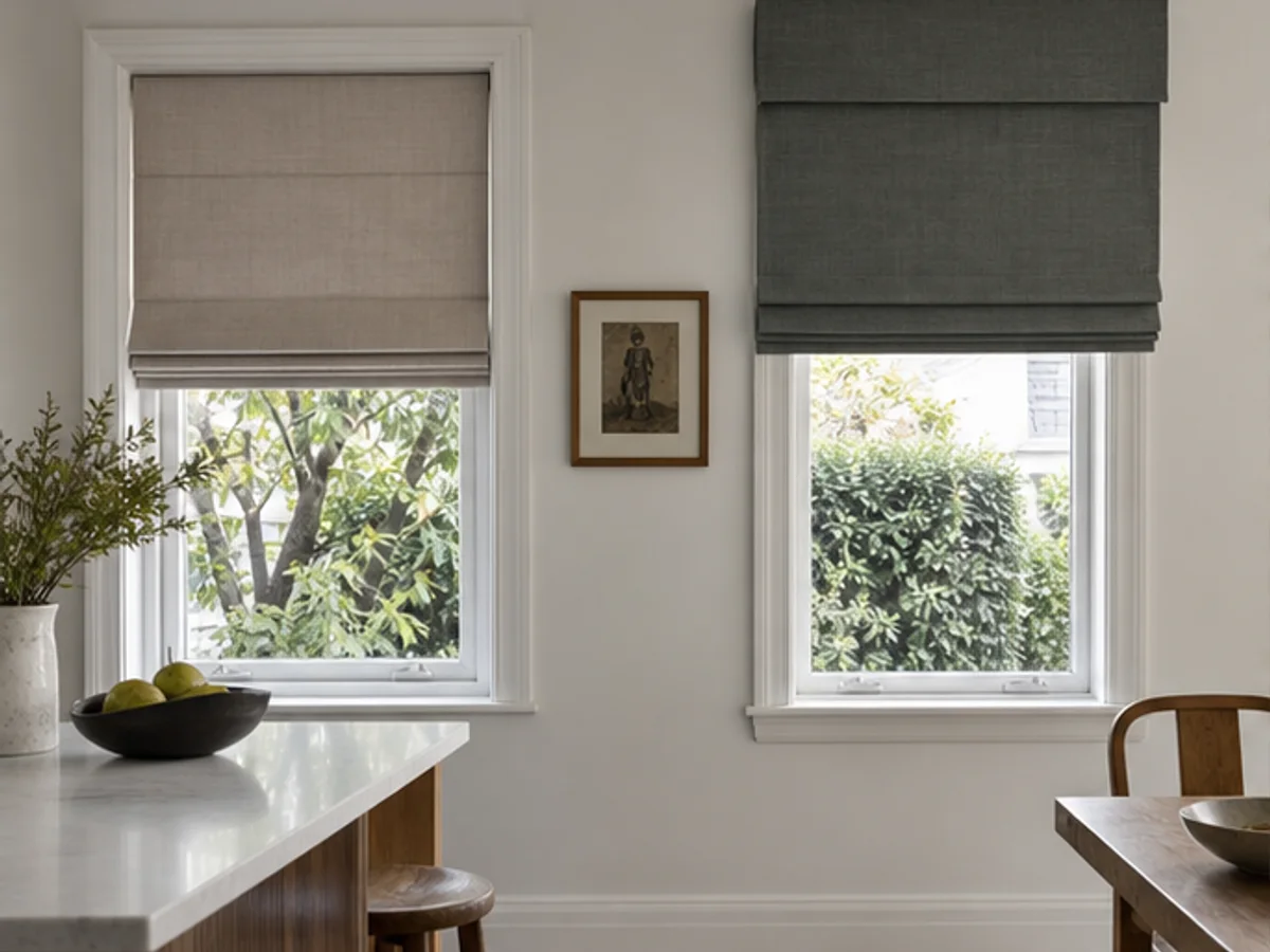 Recess-fit and face-fit Roman blinds shown on two different windows with visible architraves