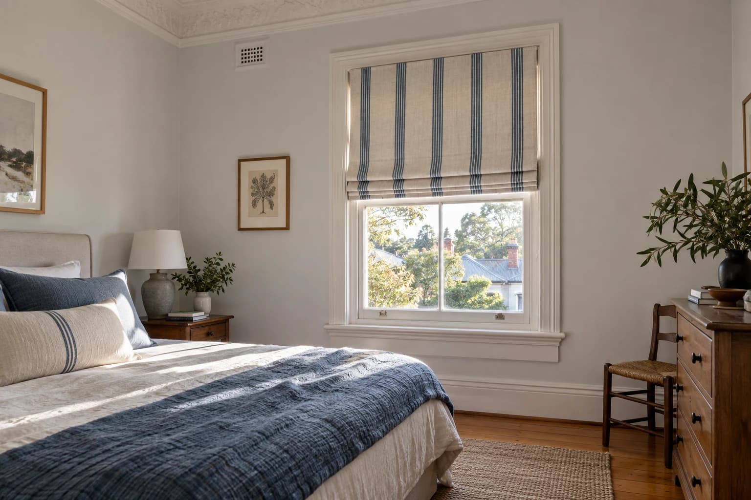 Striped Roman blind in a Sydney Federation bedroom with the original sash window and surrounding architecture clearly visible.