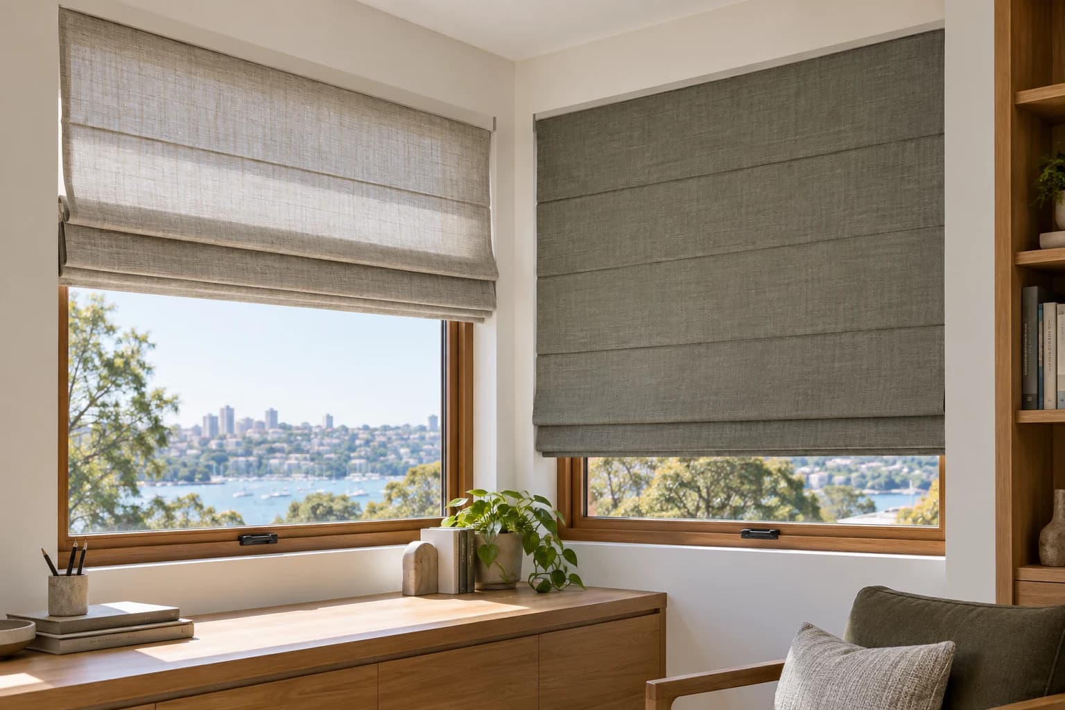 Two separate Roman blinds resolved around a ninety-degree corner without intersecting headrails.