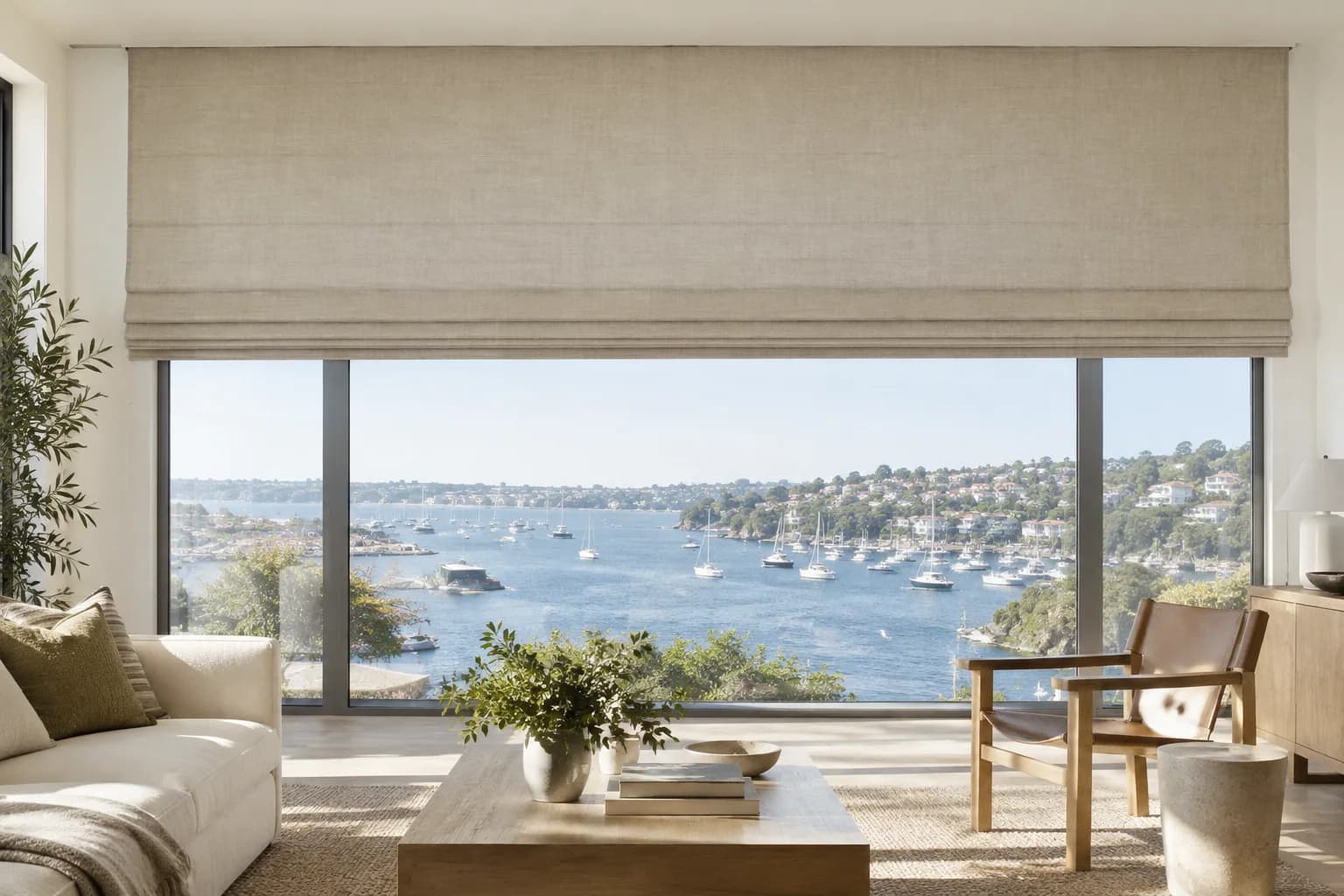 Large motorised linen Roman blind integrated into a Sydney living room