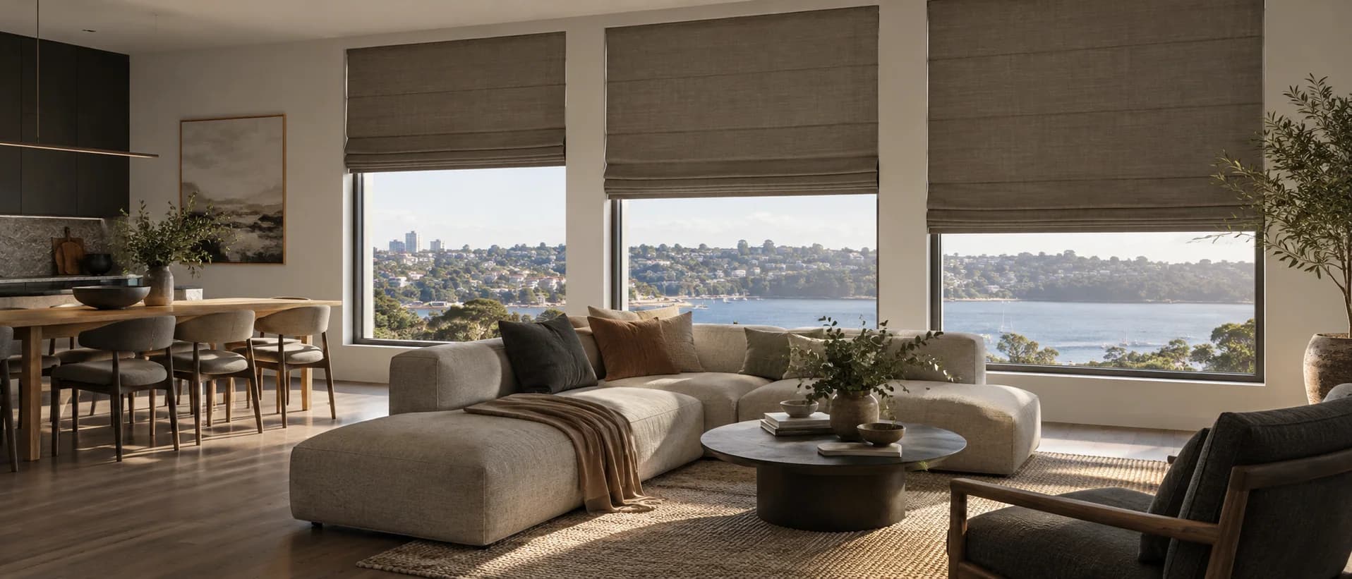 Three motorised Roman blinds set evenly across a composed Sydney living room