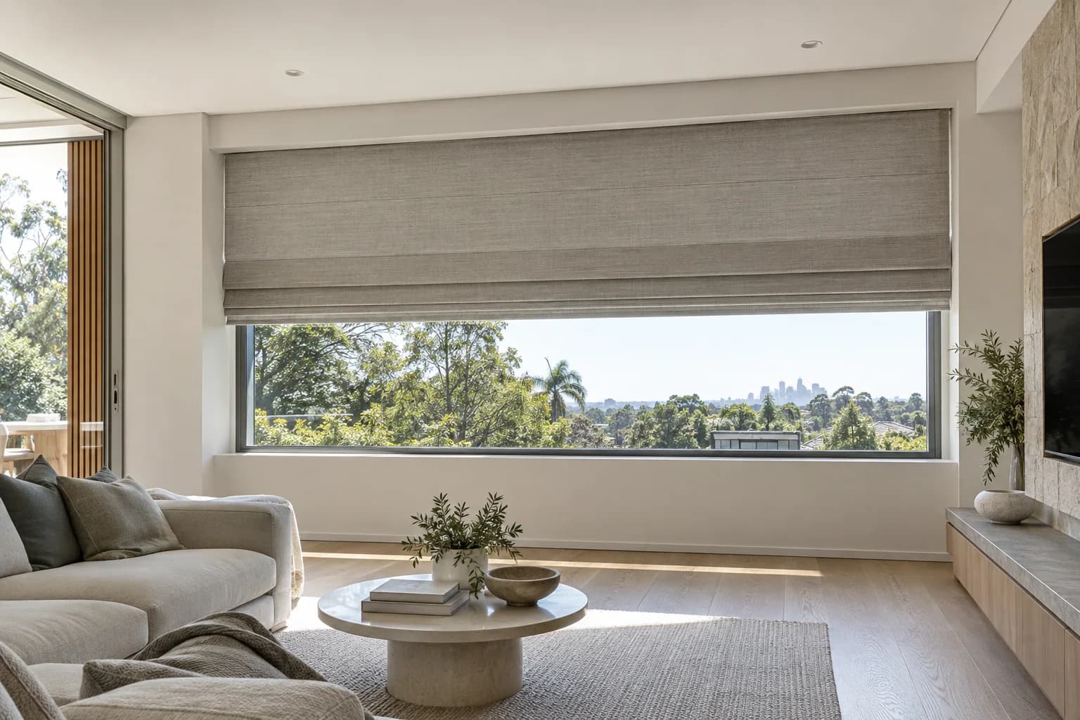 Concealed motorised Roman blind planned into a contemporary Australian living room