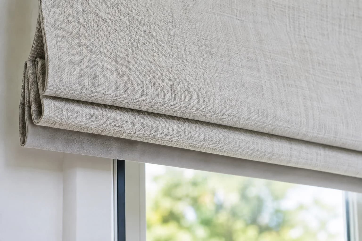 Finished lower edge of a motorised Roman blind