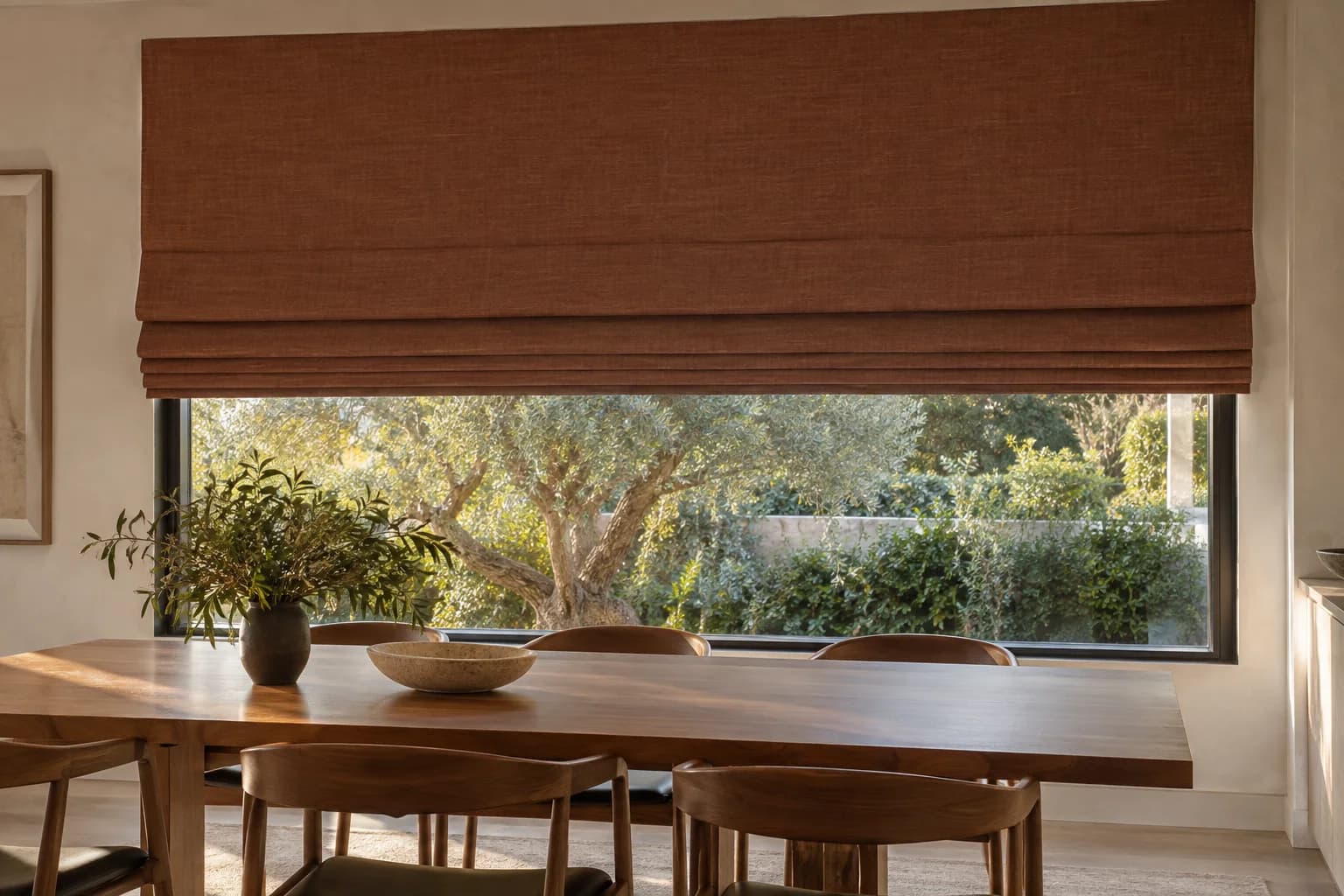 Large clay-coloured Roman blind across a wide dining-room window