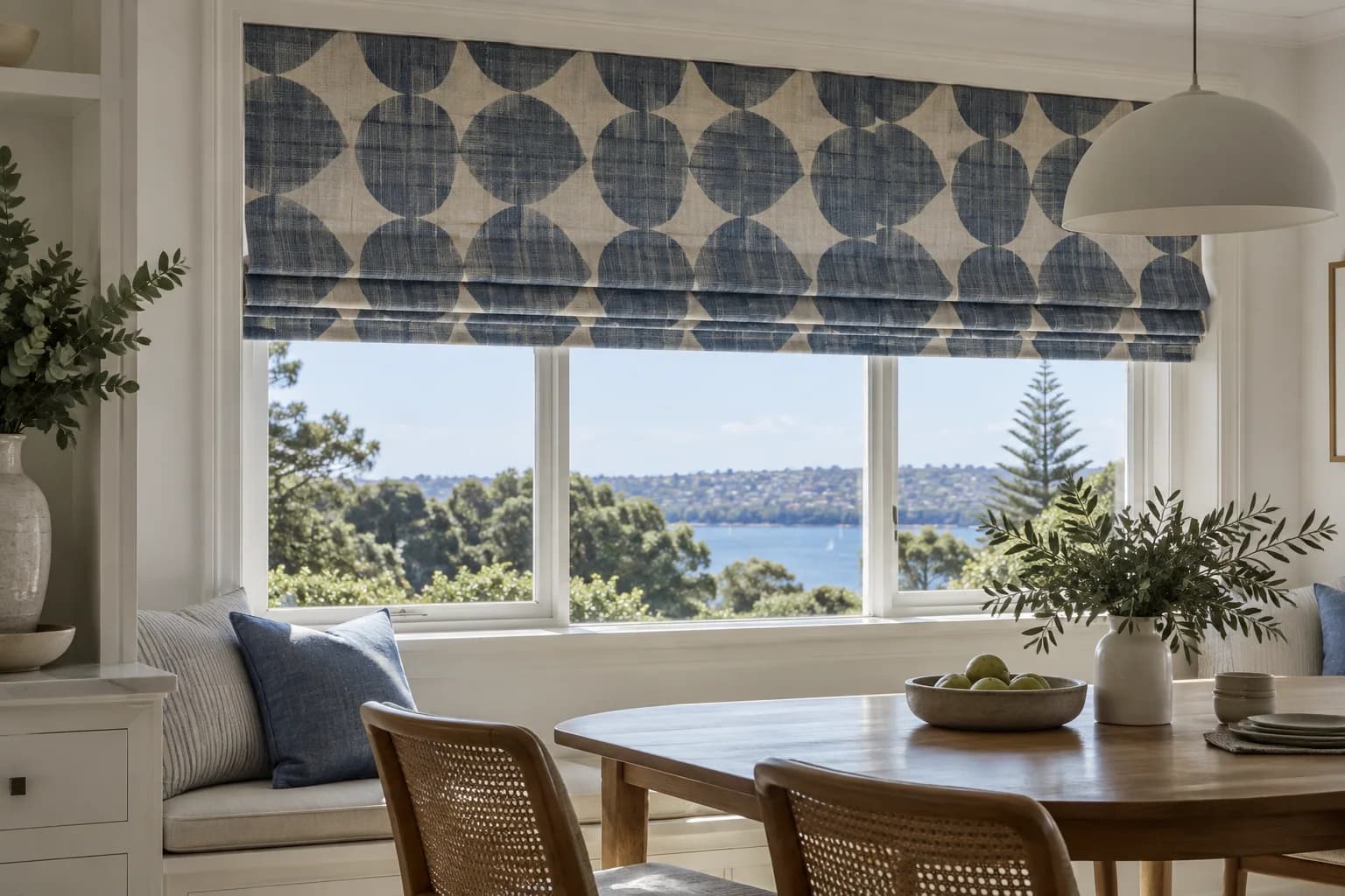 Patterned motorised Roman blind in a Sydney dining nook