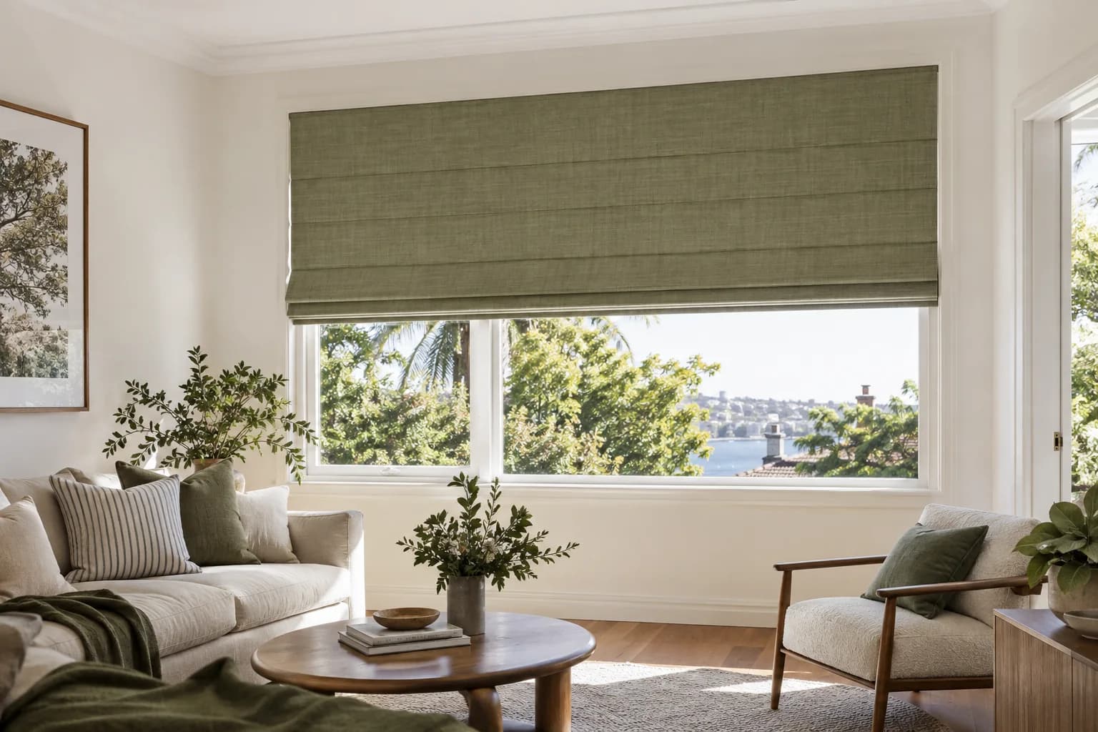 Tailored green Classic Roman blind across a wide Sydney living-room window