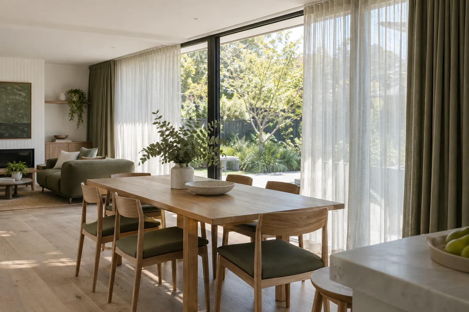 Layered sheer and lined curtains within a complete living room