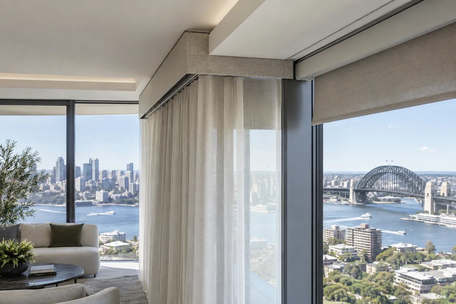 Integrated curtain track and roller headbox detail at architectural glazing
