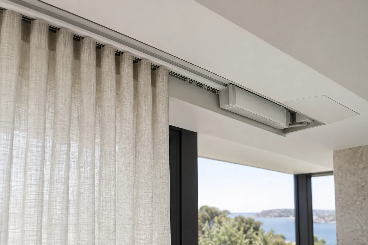 Concealed motorised curtain track with a resolved ceiling service opening