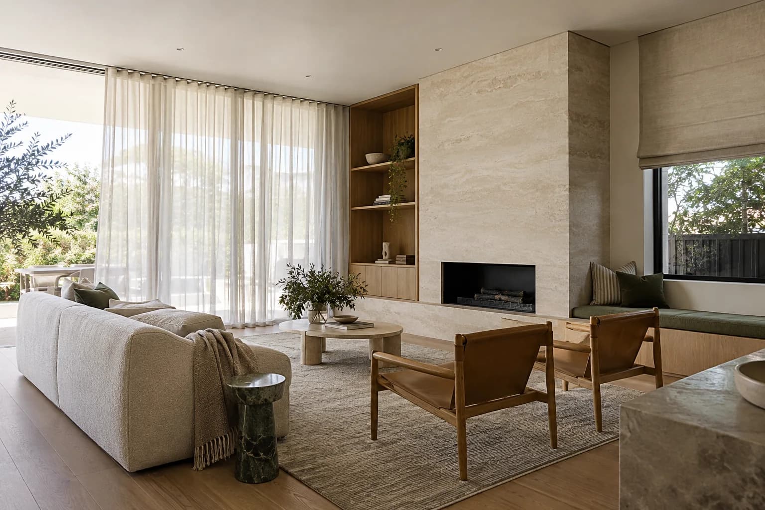 Sheer curtains along large glazing in an open living room