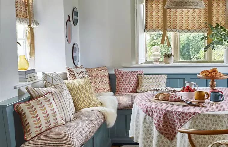 Layered patterned window furnishings in a furnished living space