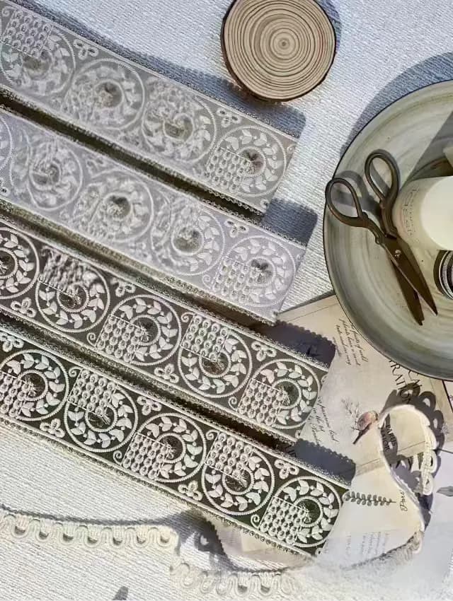 Fabric, scissors and trim arranged for careful cutting and alignment