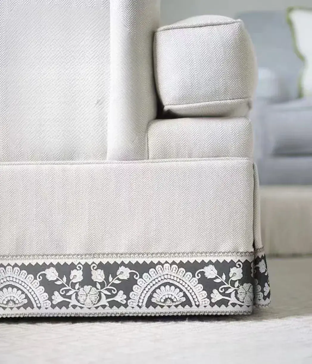 Close textile view showing a precisely finished seam and edge