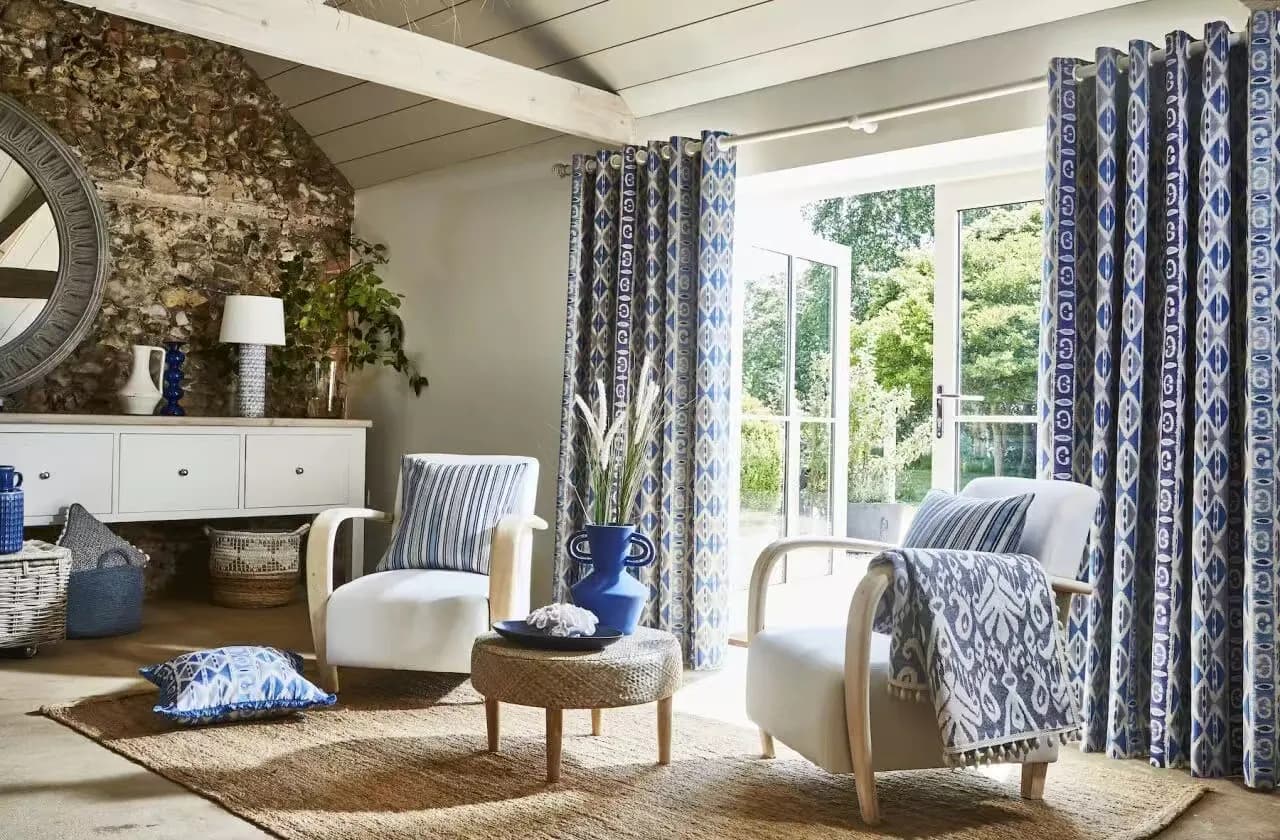 Contemporary living room with neutral ceiling-mounted S-fold sheers and clean architecture