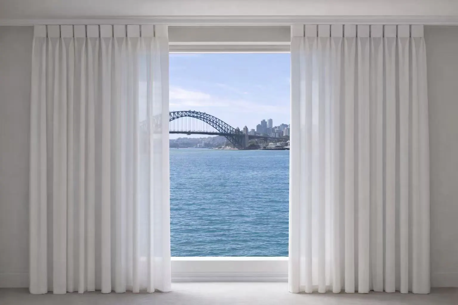Full-height sheer and substantial curtain layers framing a wide window