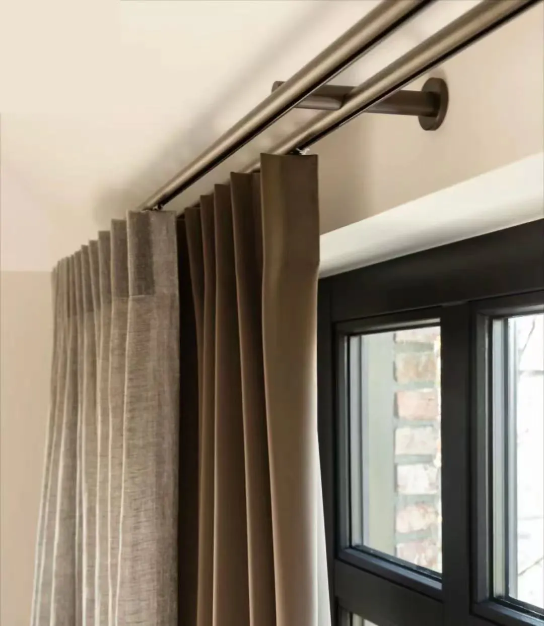 Close view of a curtain returning neatly towards its supporting hardware