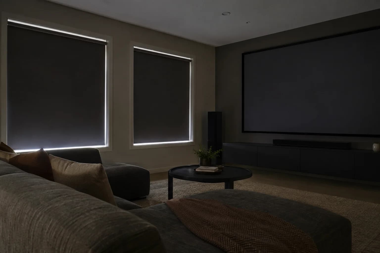 Blockout blinds reducing daylight in a residential media room