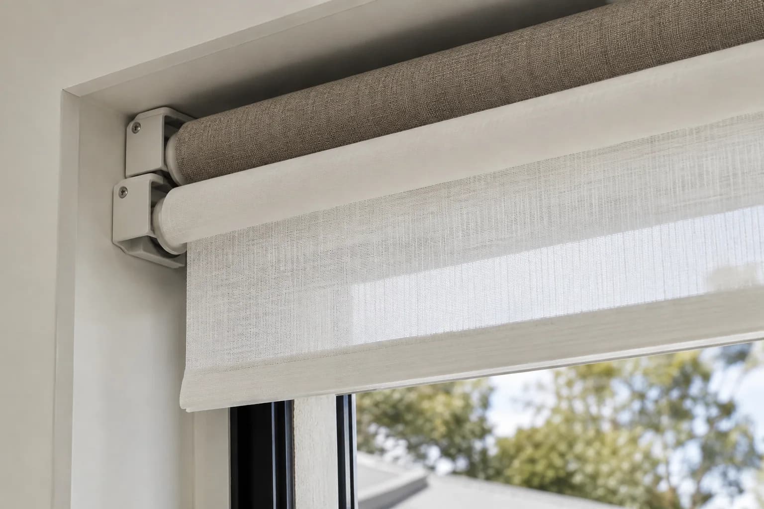 Two roller tubes installed on a compact double bracket
