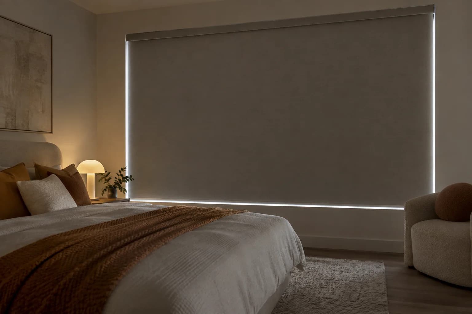 Cord-free motorised blockout blind fully lowered in a bedroom