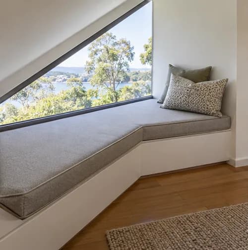 Custom cushion following an angled architectural window seat