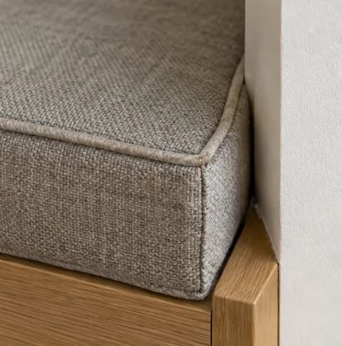 Close view of piping and an accurately fitted cushion corner