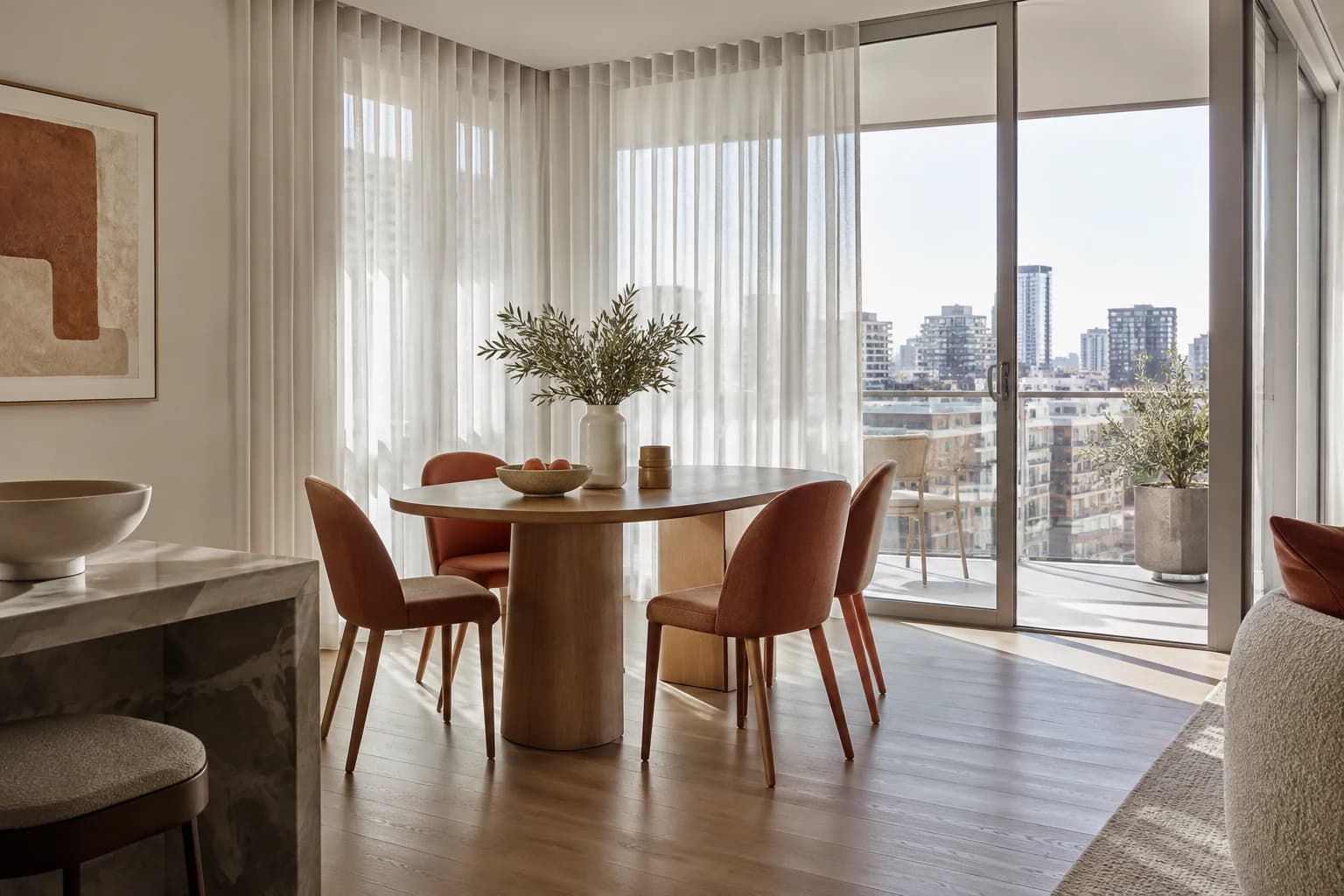 Sheer curtains softening daylight and outlook in an apartment living room