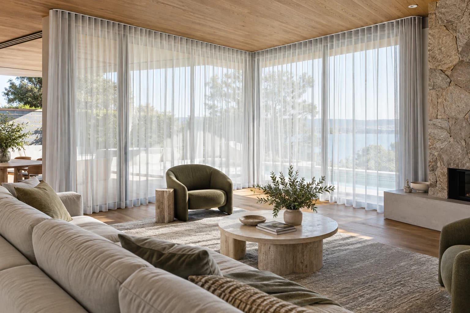 Sheer curtains across bright corner glazing in a Sydney-style living room