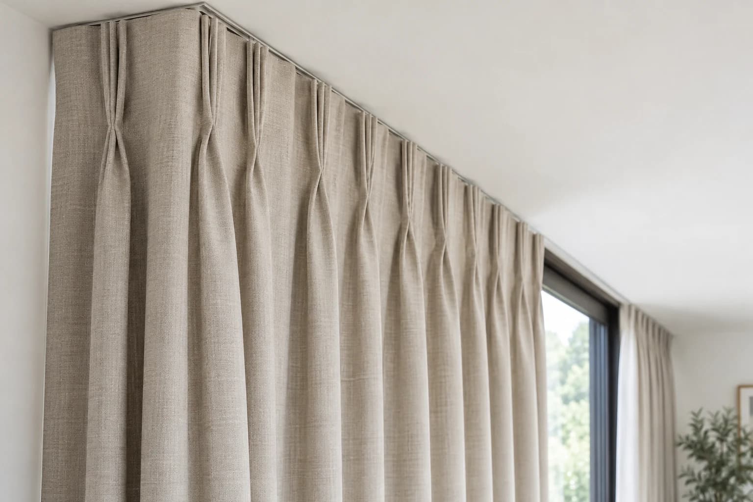 Close crop showing the ordered heading and fullness of a full-height curtain