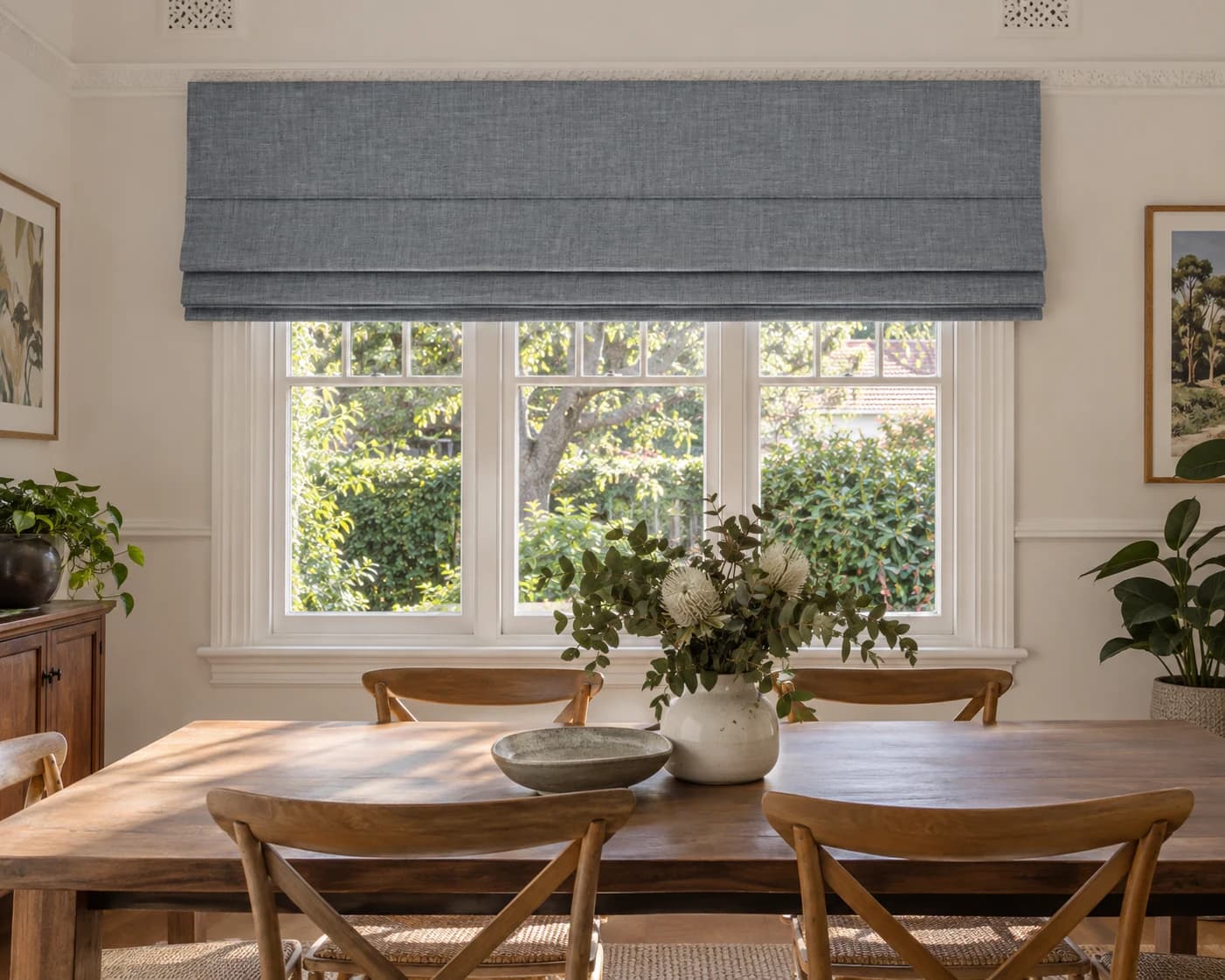 Outside-mounted Roman blind overlapping the frame for greater coverage